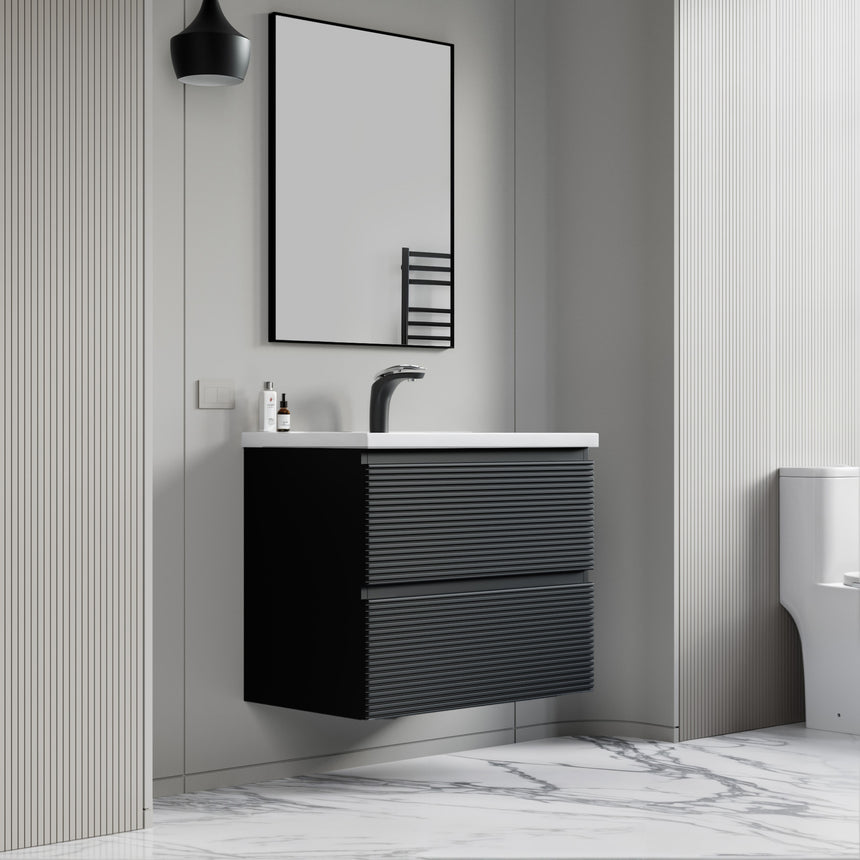 Bathroom vanity with wooden finish and white countertop against a gray wall.