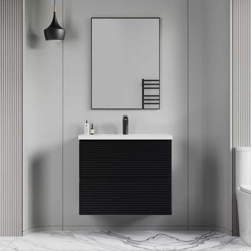 Bathroom vanity with wooden finish and white countertop against a gray wall.