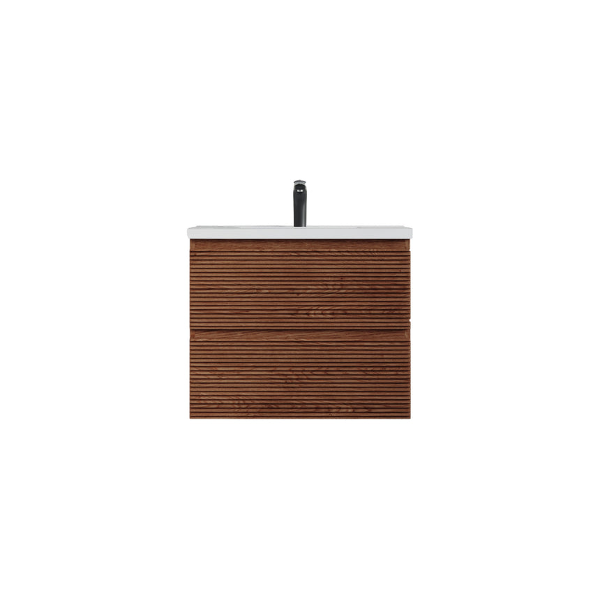 Bathroom vanity with wooden finish and white countertop against a gray wall.