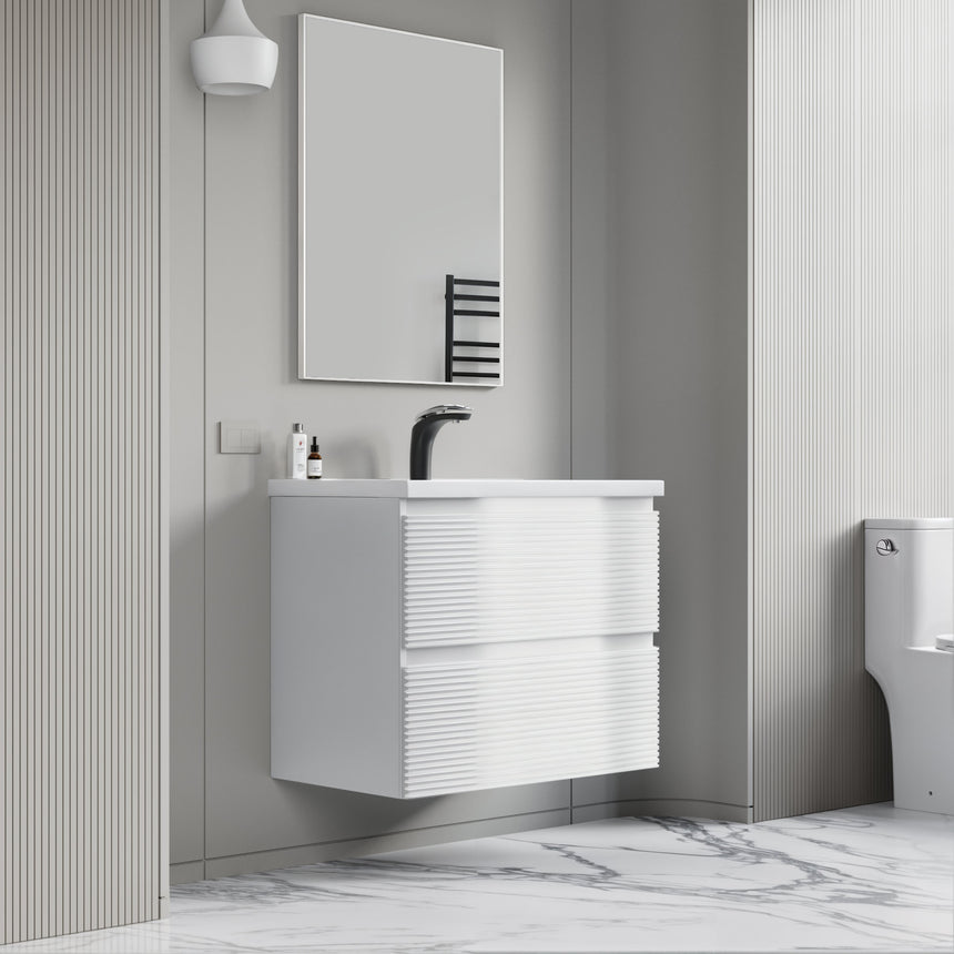 Bathroom vanity with wooden finish and white countertop against a gray wall.