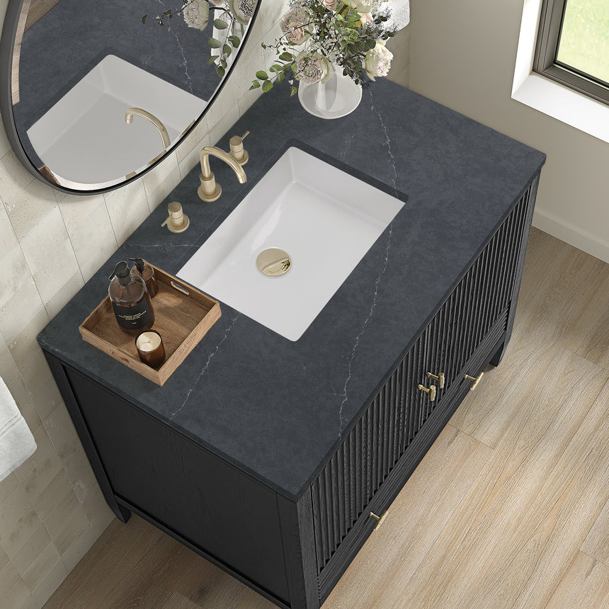 White bathroom vanity with marble countertop and decorative flowers in a bathroom setting.
