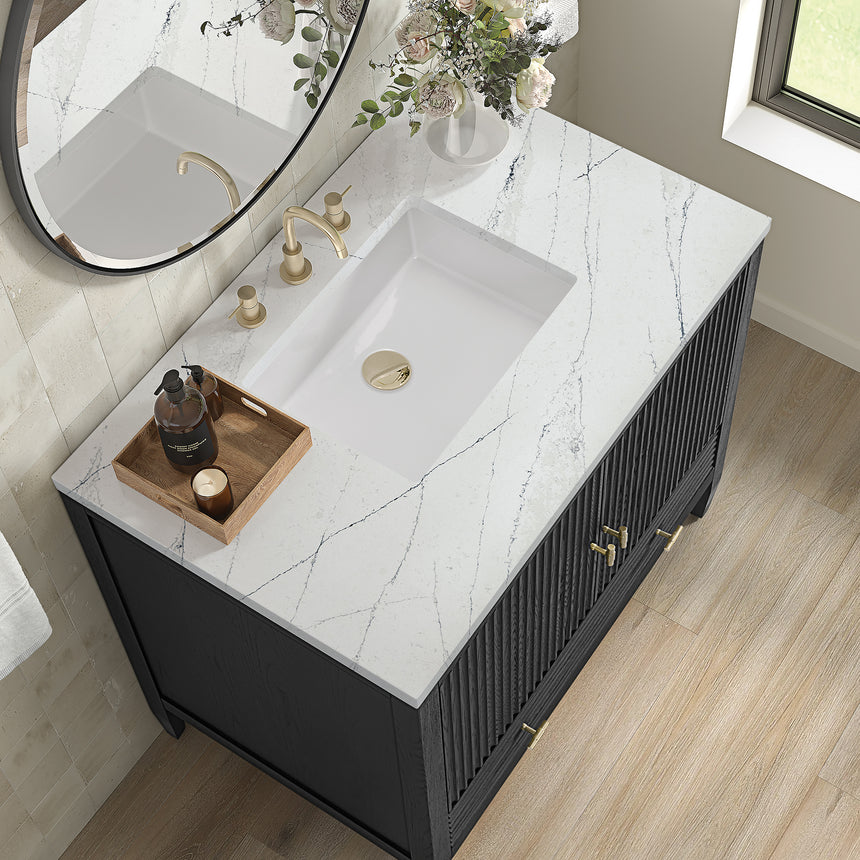 White bathroom vanity with marble countertop and decorative flowers in a bathroom setting.