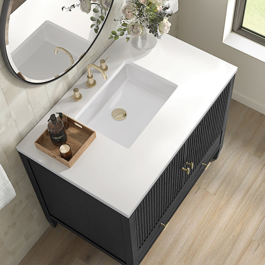 White bathroom vanity with marble countertop and decorative flowers in a bathroom setting.