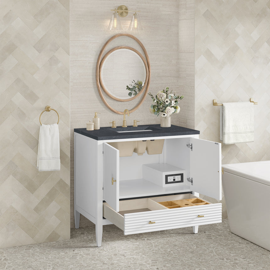 White bathroom vanity with marble countertop and decorative flowers in a bathroom setting.