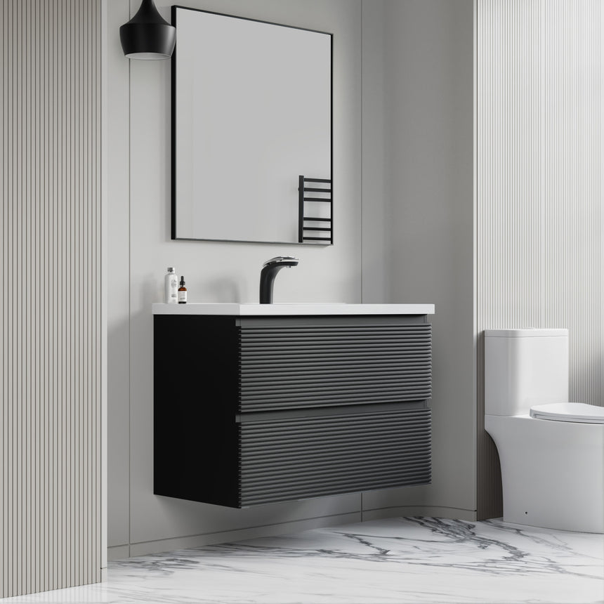 Bathroom vanity with wooden finish and white countertop against a gray wall.
