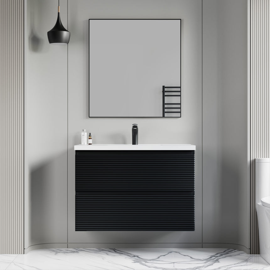 Bathroom vanity with wooden finish and white countertop against a gray wall.