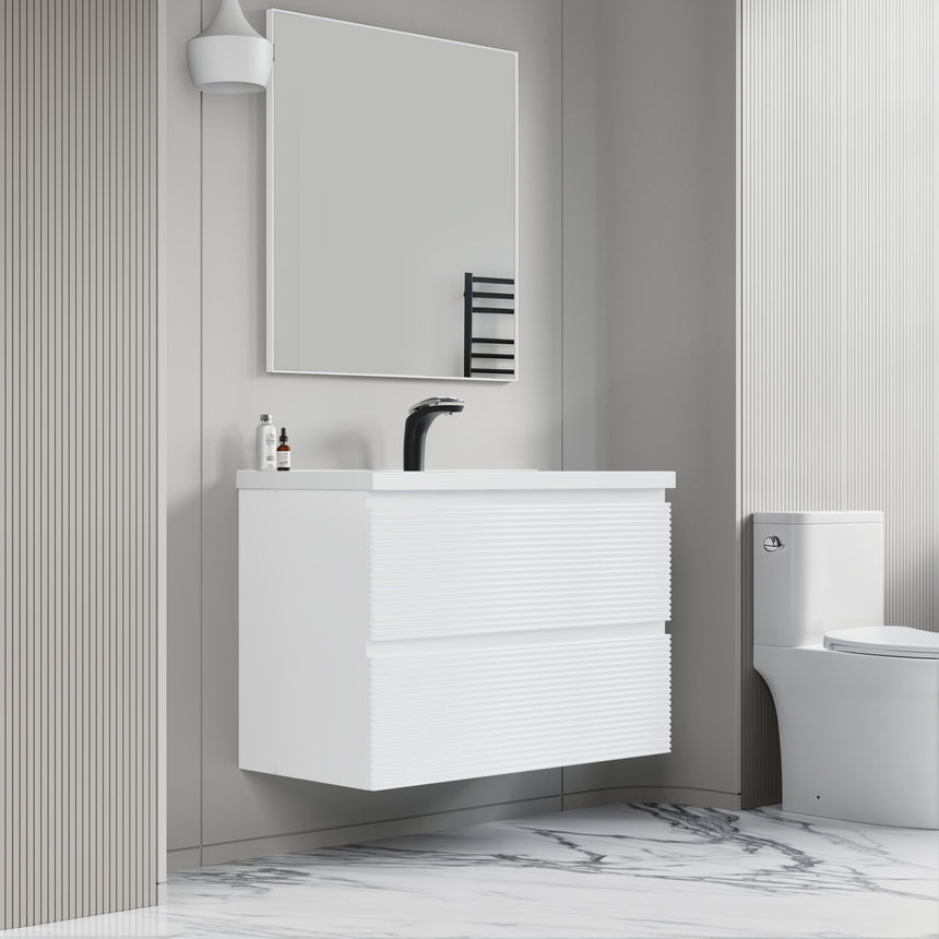 Bathroom vanity with wooden finish and white countertop against a gray wall.