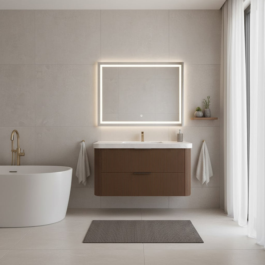 Modern bathroom with wooden vanity, freestanding bathtub, and shower area.