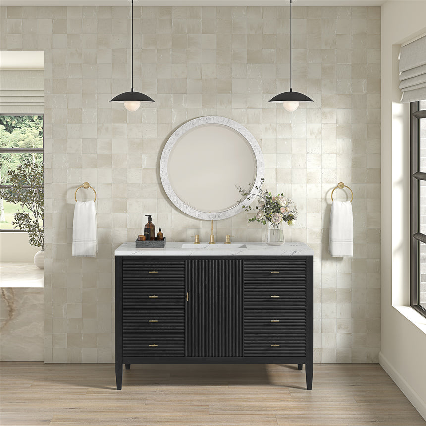 White bathroom vanity with marble countertop and decorative flowers in a bathroom setting.