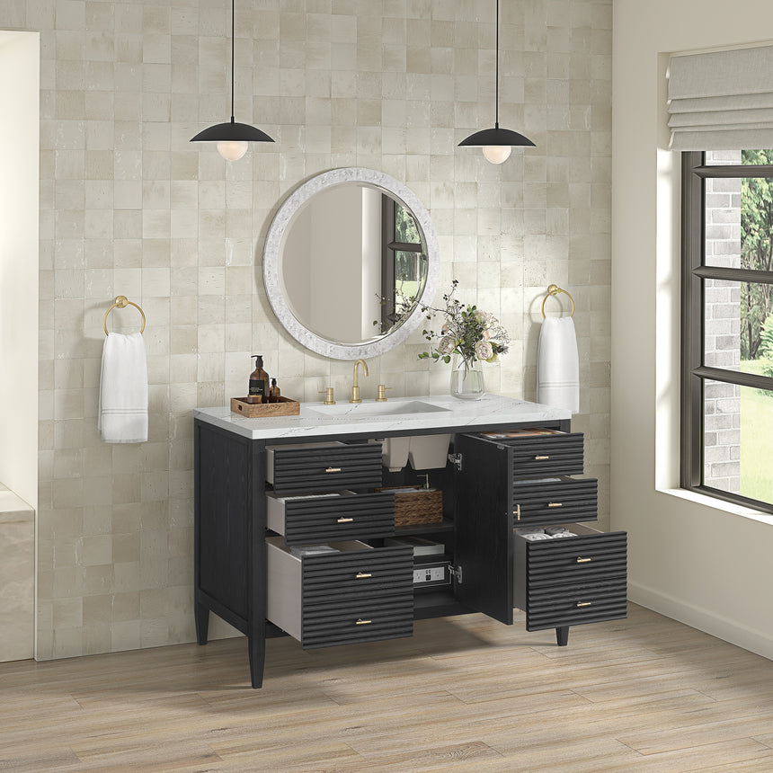 White bathroom vanity with marble countertop and decorative flowers in a bathroom setting.