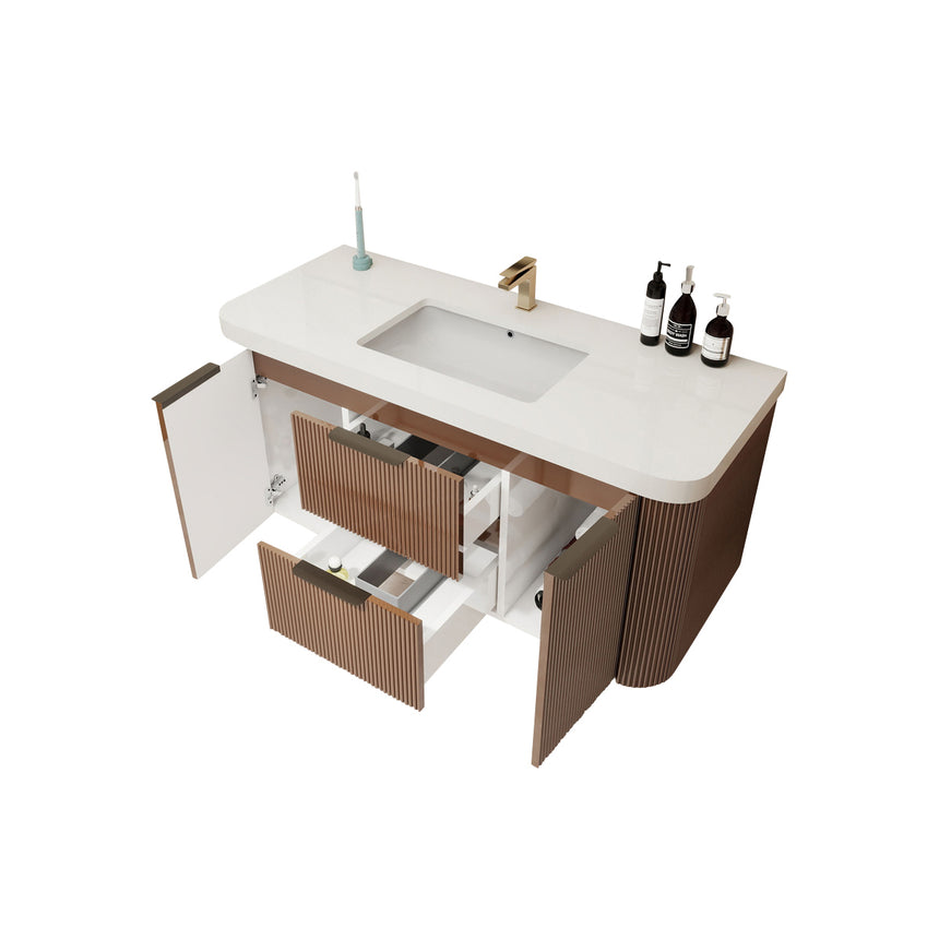 Modern bathroom with wooden vanity, freestanding bathtub, and shower area.