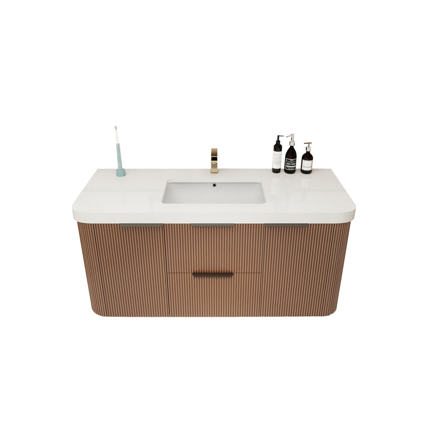 Modern bathroom with wooden vanity, freestanding bathtub, and shower area.