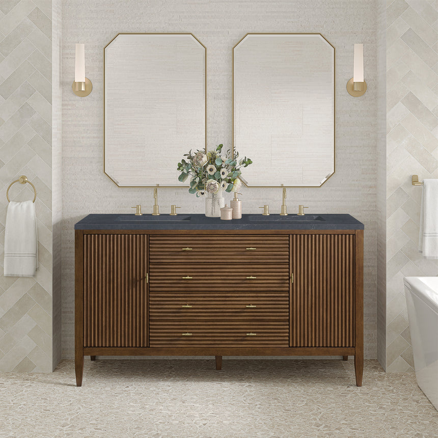 White bathroom vanity with marble countertop and decorative flowers in a bathroom setting.