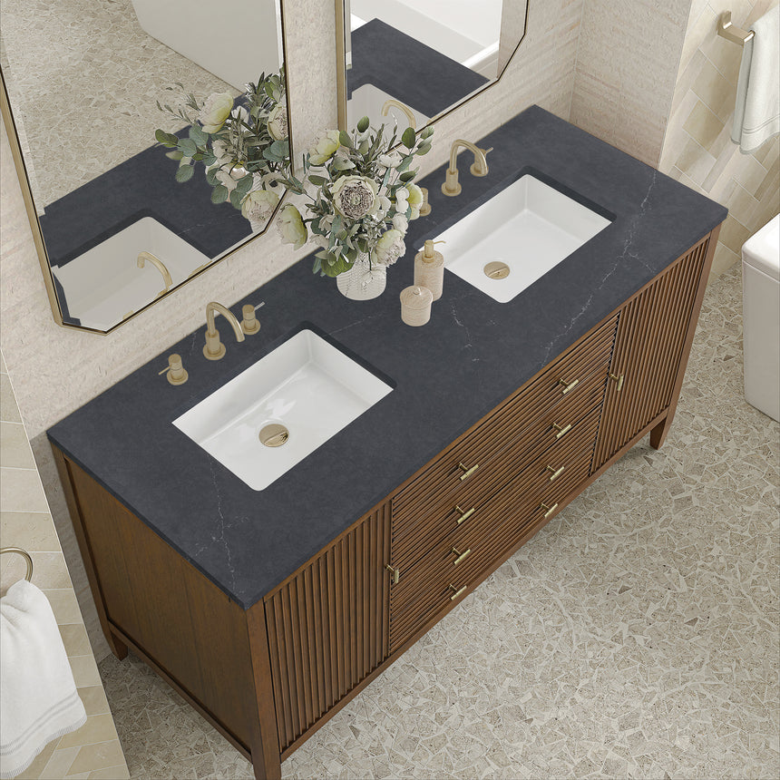 White bathroom vanity with marble countertop and decorative flowers in a bathroom setting.