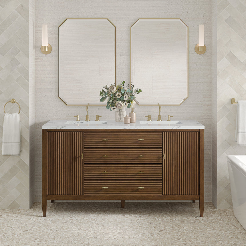 White bathroom vanity with marble countertop and decorative flowers in a bathroom setting.