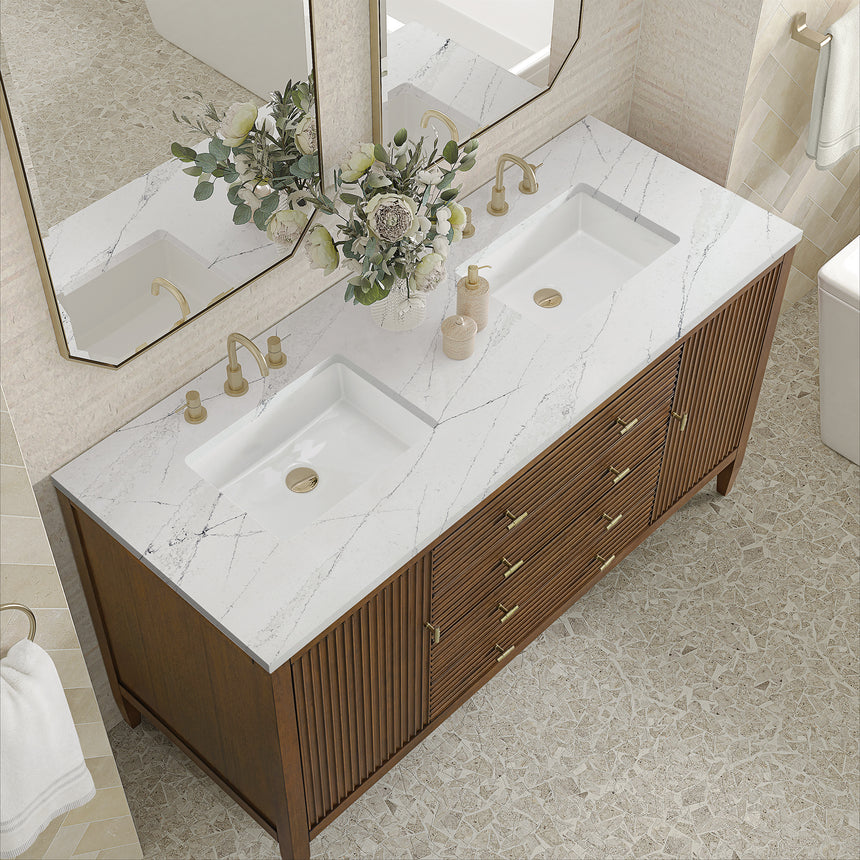 White bathroom vanity with marble countertop and decorative flowers in a bathroom setting.