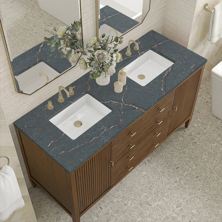 White bathroom vanity with marble countertop and decorative flowers in a bathroom setting.