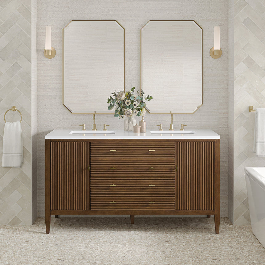 White bathroom vanity with marble countertop and decorative flowers in a bathroom setting.
