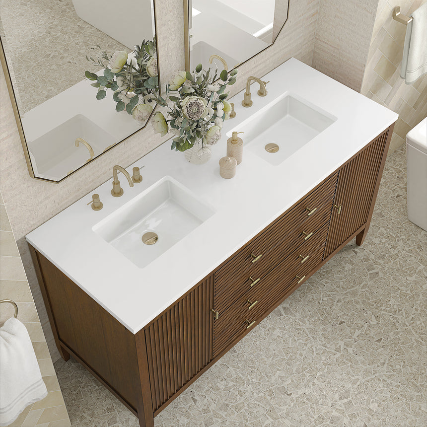White bathroom vanity with marble countertop and decorative flowers in a bathroom setting.