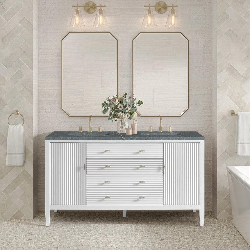 White bathroom vanity with marble countertop and decorative flowers in a bathroom setting.