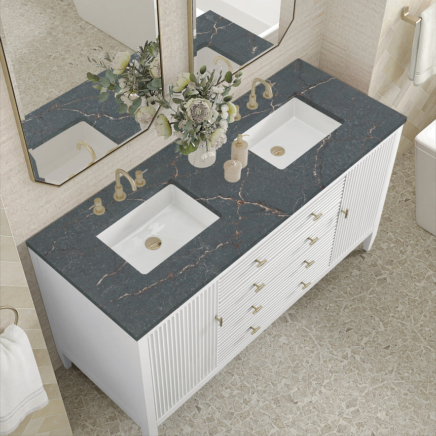 White bathroom vanity with marble countertop and decorative flowers in a bathroom setting.