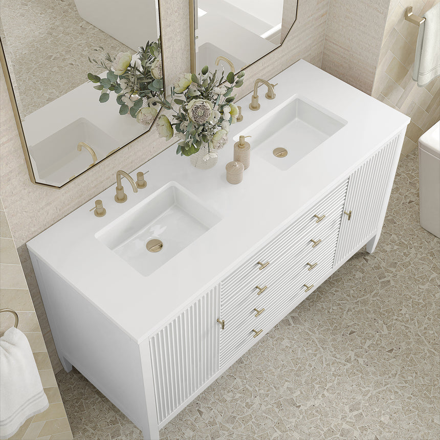 White bathroom vanity with marble countertop and decorative flowers in a bathroom setting.