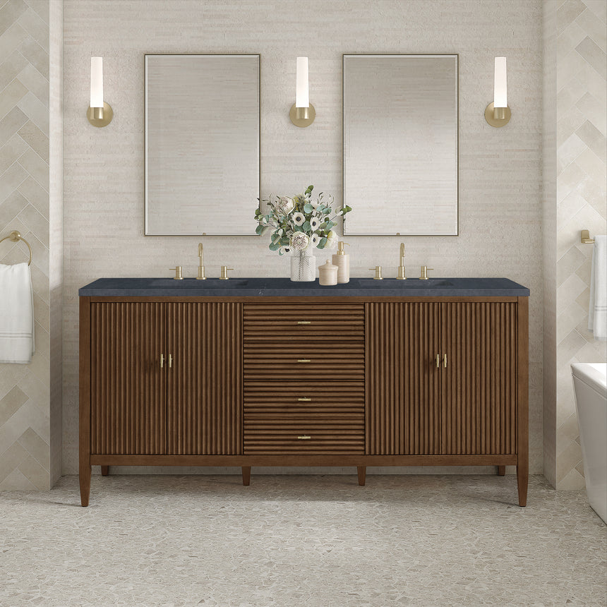 White bathroom vanity with marble countertop and decorative flowers in a bathroom setting.