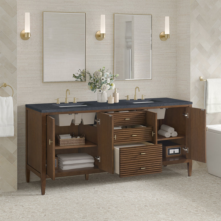 White bathroom vanity with marble countertop and decorative flowers in a bathroom setting.