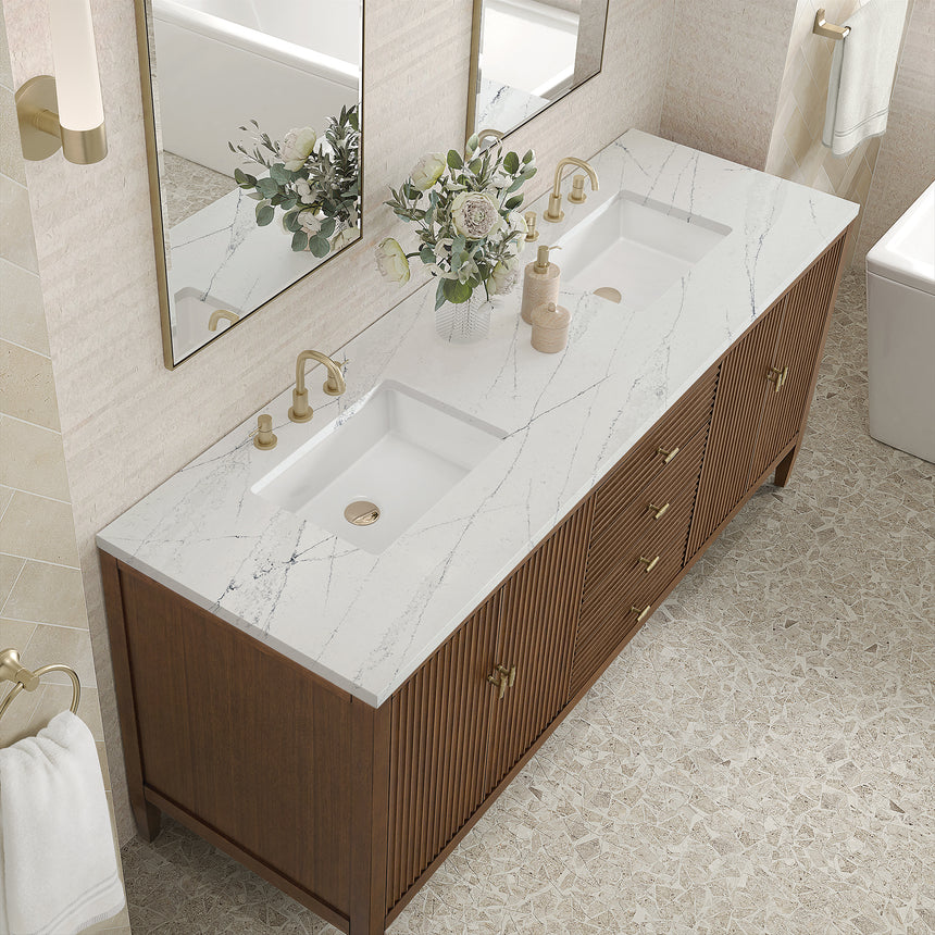 White bathroom vanity with marble countertop and decorative flowers in a bathroom setting.