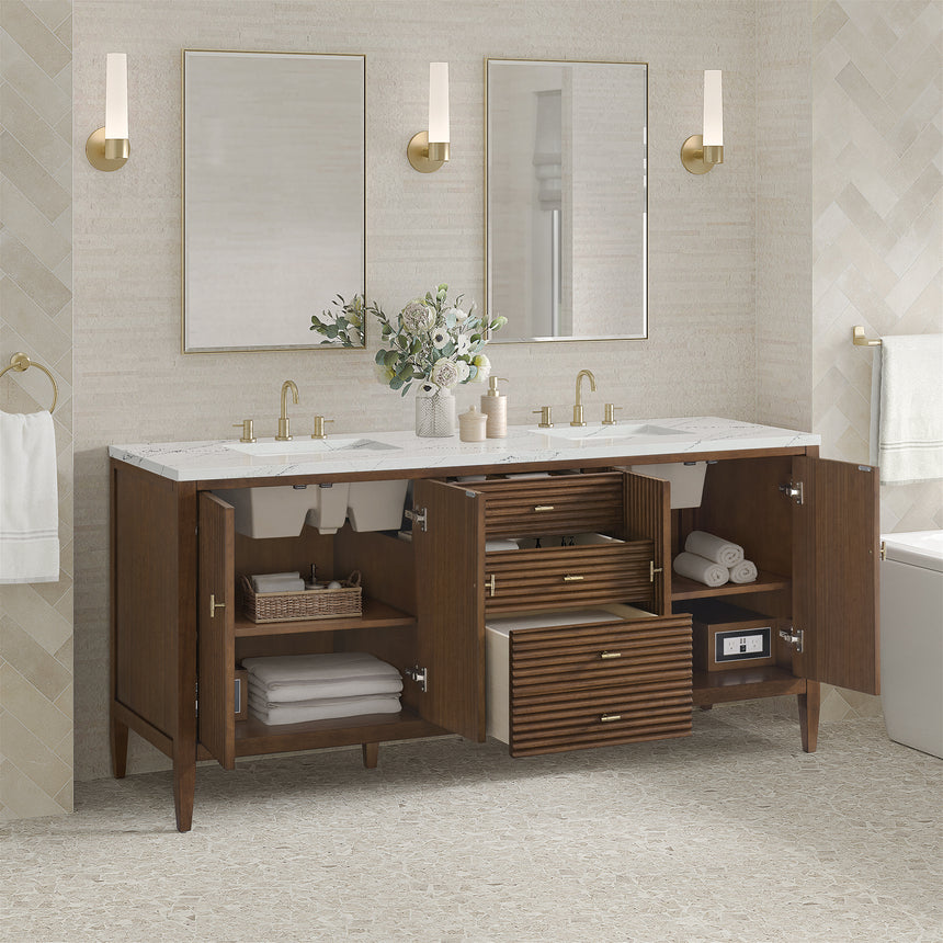 White bathroom vanity with marble countertop and decorative flowers in a bathroom setting.