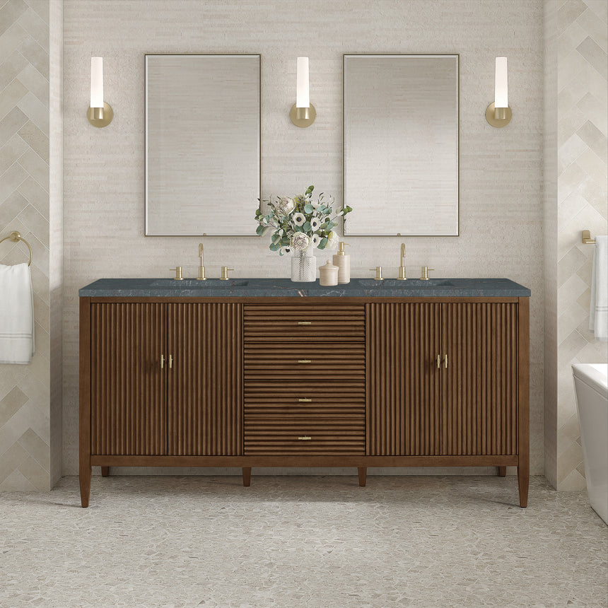 White bathroom vanity with marble countertop and decorative flowers in a bathroom setting.