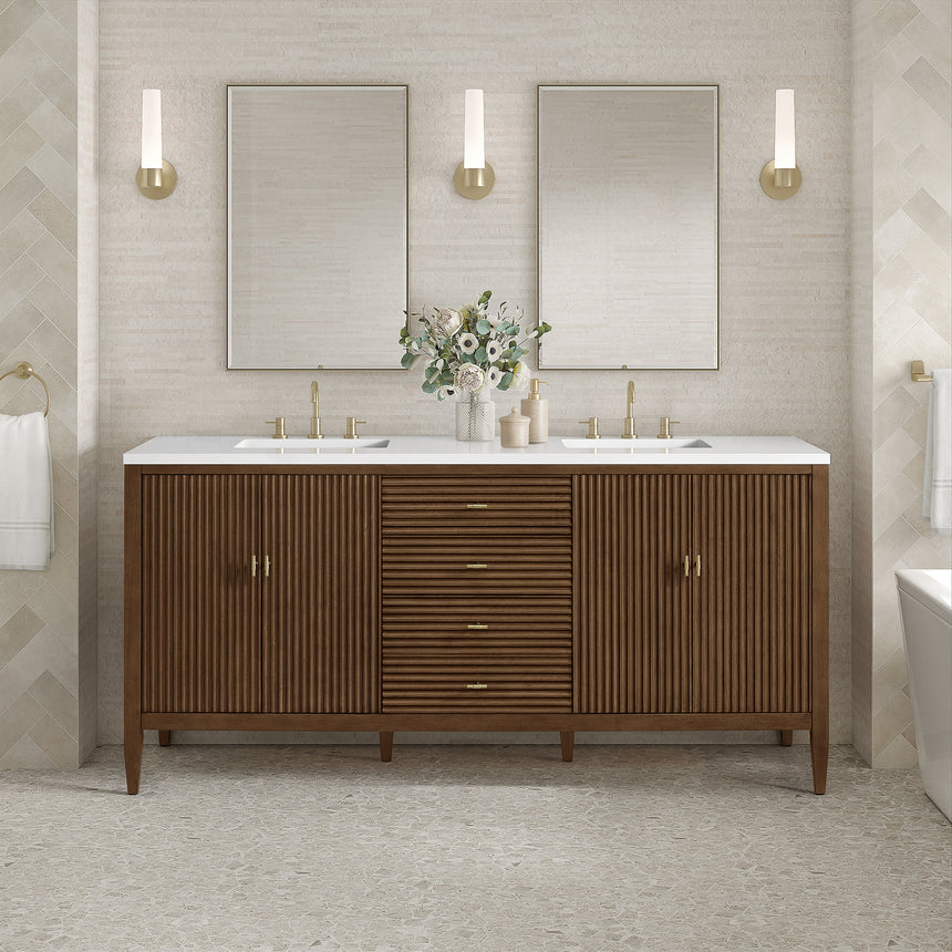 White bathroom vanity with marble countertop and decorative flowers in a bathroom setting.