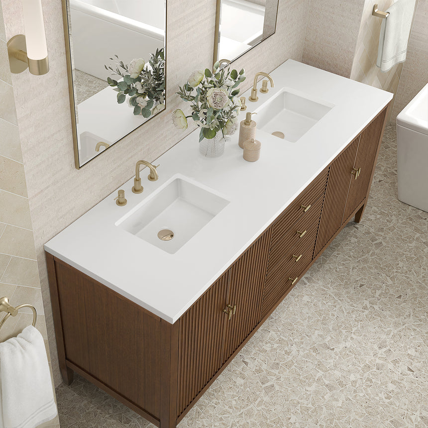 White bathroom vanity with marble countertop and decorative flowers in a bathroom setting.