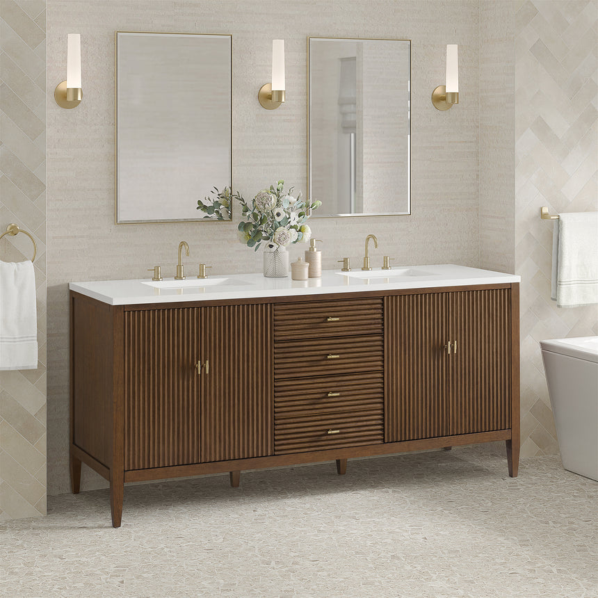 White bathroom vanity with marble countertop and decorative flowers in a bathroom setting.