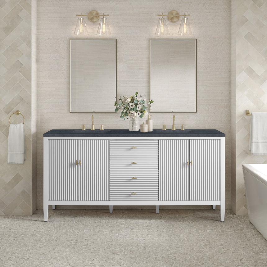 White bathroom vanity with marble countertop and decorative flowers in a bathroom setting.