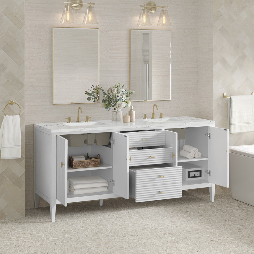 White bathroom vanity with marble countertop and decorative flowers in a bathroom setting.