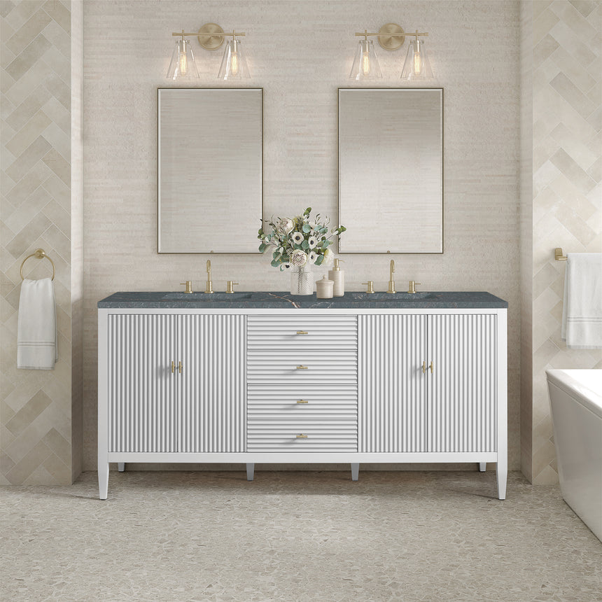 White bathroom vanity with marble countertop and decorative flowers in a bathroom setting.