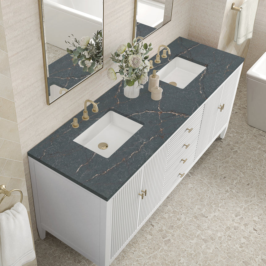 White bathroom vanity with marble countertop and decorative flowers in a bathroom setting.