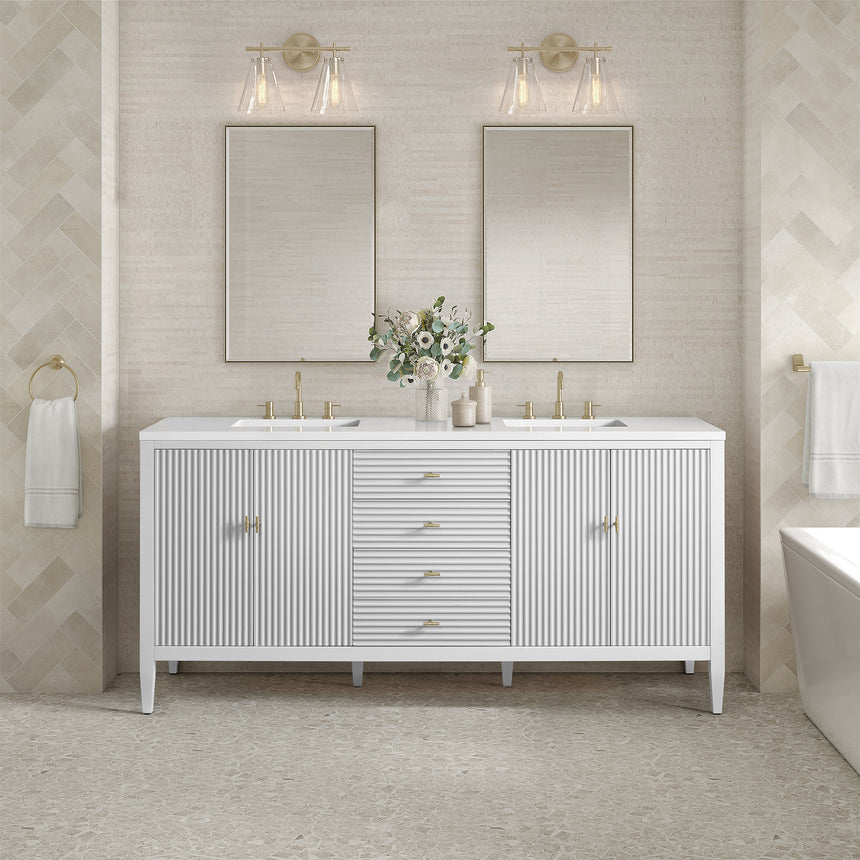 White bathroom vanity with marble countertop and decorative flowers in a bathroom setting.