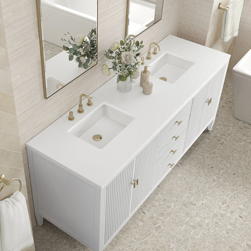 White bathroom vanity with marble countertop and decorative flowers in a bathroom setting.