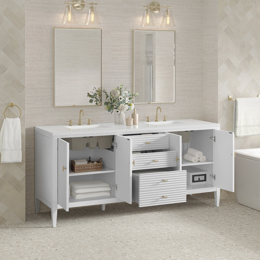 White bathroom vanity with marble countertop and decorative flowers in a bathroom setting.