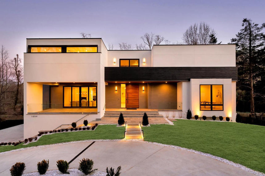 Modern luxury home exterior with palm trees and minimalist landscaping in Henderson, NV.