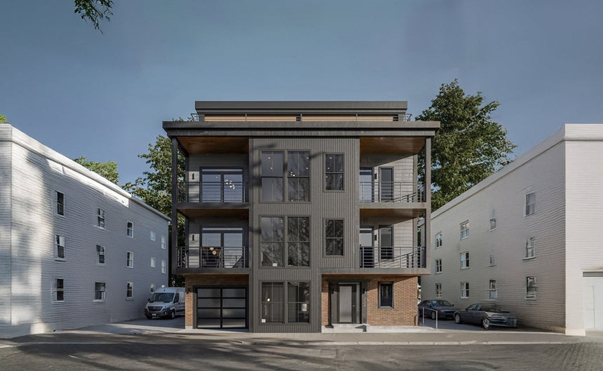 Contemporary two-story home exterior with black trim and modern garage design