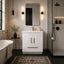 Modern bathroom with white vanity, freestanding bathtub, and shower area.