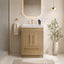 Bathroom vanity with wooden cabinet, mirror, and decorative elements.