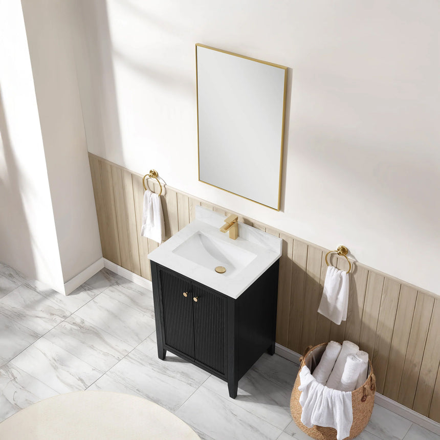 Bathroom vanity with double sink, mirrors, and towels in a well-lit room.