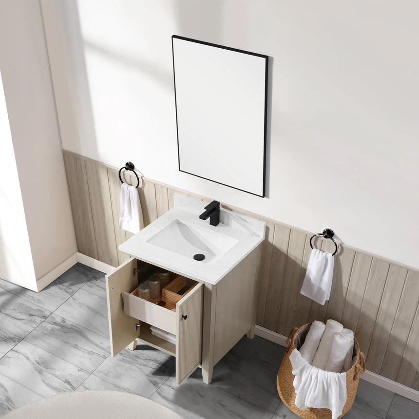 Bathroom vanity with double sink, mirrors, and towels in a well-lit room.