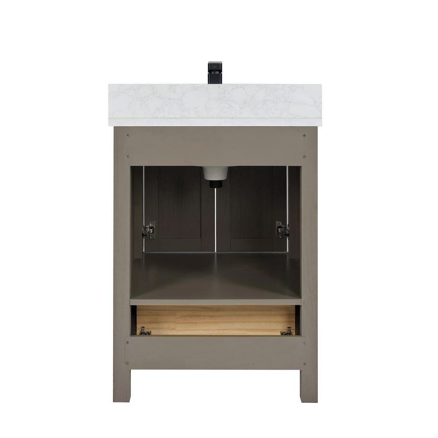 Bathroom vanity with wooden cabinets and white countertop, featuring a toilet and towel on the side.