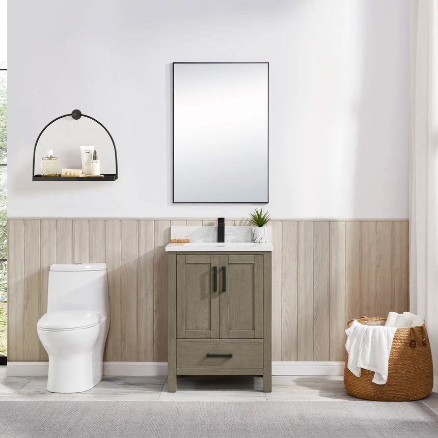 Bathroom vanity with wooden cabinets and white countertop, featuring a toilet and towel on the side.