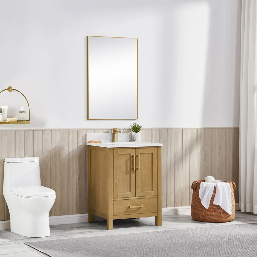 Bathroom vanity with wooden cabinets and white countertop, featuring a toilet and towel on the side.